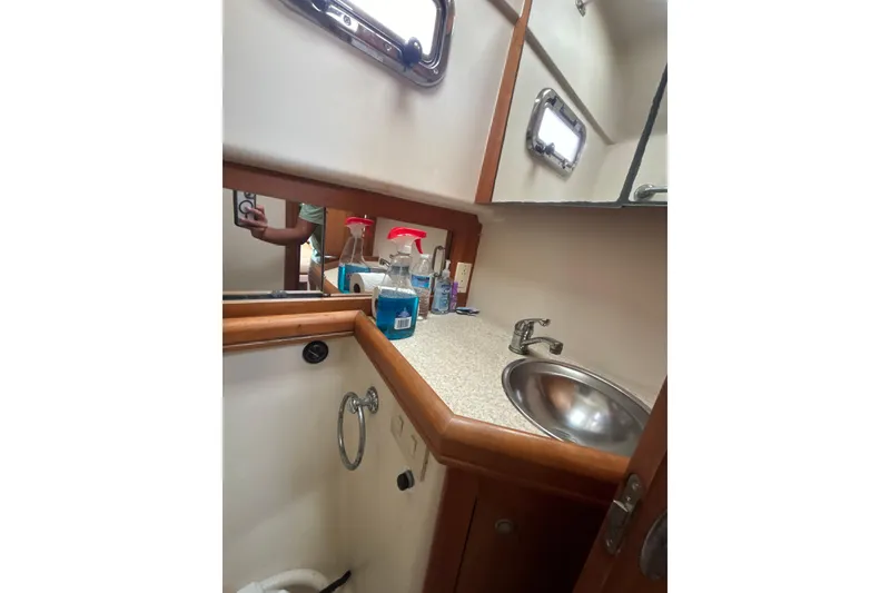 Slide: The Image of Bathroom interior of 2005 Mainship Pilot 34 boat with shower and toilet. - 27