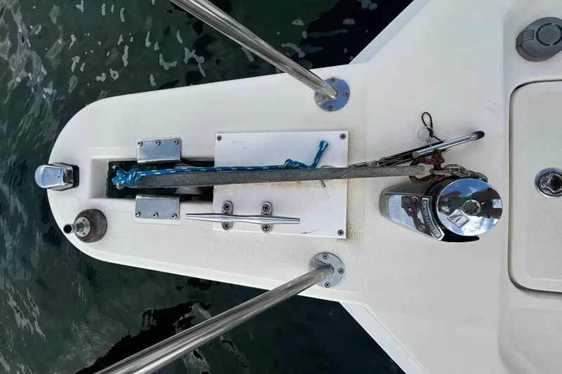 Slide: The Image of 2005 Mainship Pilot 34 boat docked at marina, view of deck and cabin. - 6