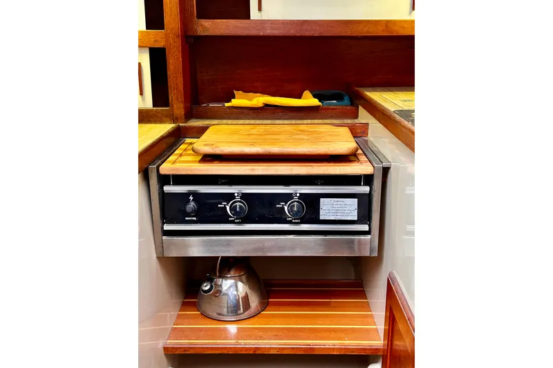 Slide: The Image of Compact CNG 2-Burner stove and obligatory kettle. - 6