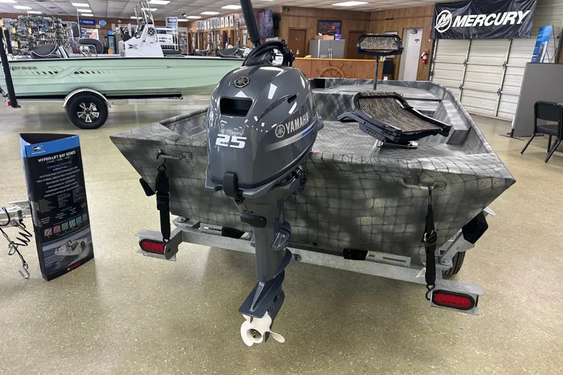 Slide: The Image of 2025 WeldBilt 1652 boat with Yamaha 25 outboard motor displayed in showroom. - 7