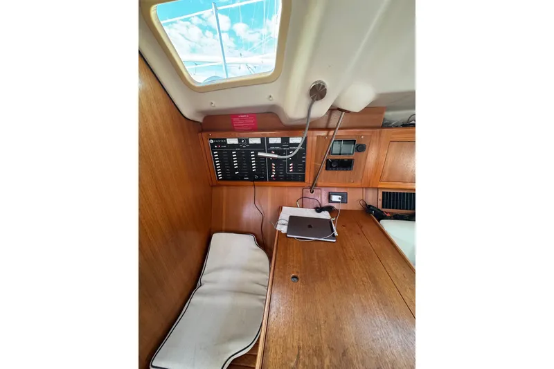 Slide: The Image of Interior of 2002 Hunter 410 sailboat with control panel and skylight. - 8