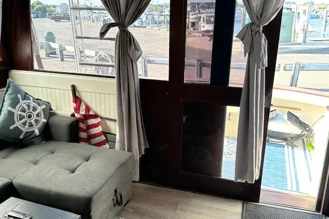 Slide: The Image of Interior of 1986 Egg Harbor 37 Convertible yacht with nautical decor and marina view. - 10