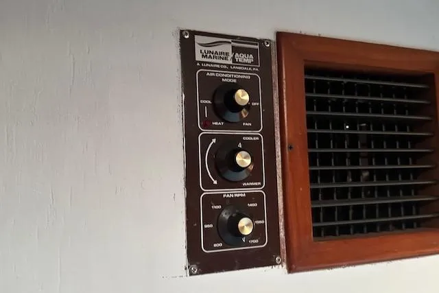 Slide: The Image of Control panel for air conditioning on 1986 Egg Harbor 37 Convertible boat. - 16