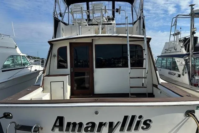 Slide: The Image of 1986 Egg Harbor 37 Convertible boat named Amaryllis docked at marina. - 2
