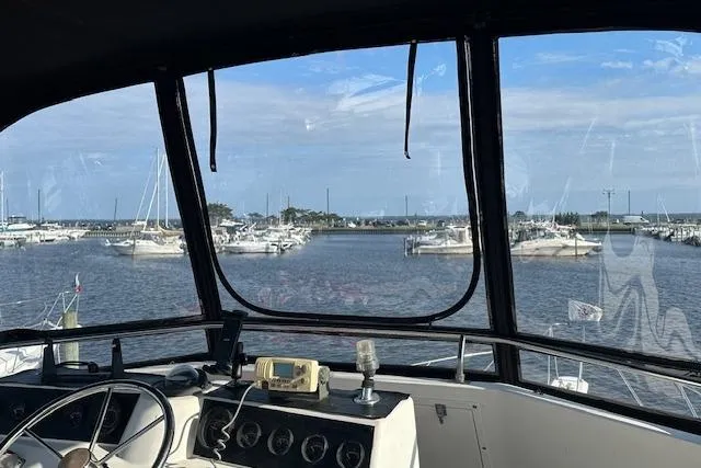 Slide: The Image of 1986 Egg Harbor 37 Convertible yacht cockpit view overlooking marina. - 22
