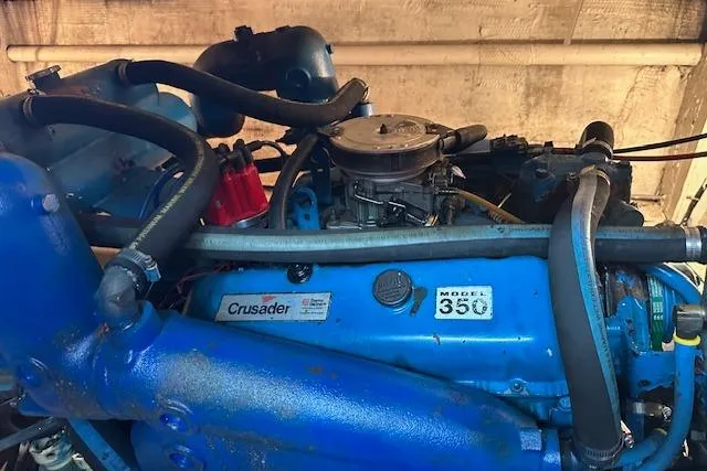 Slide: The Image of 1986 Egg Harbor 37 Convertible engine, Crusader Model 350, blue components, detailed view. - 23