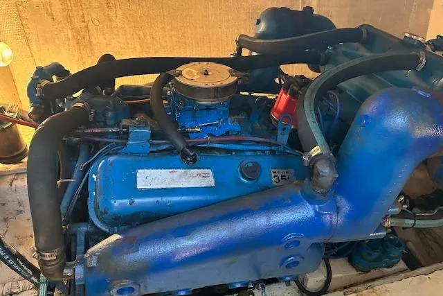 Slide: The Image of 1986 Egg Harbor 37 Convertible engine, blue components, detailed view. - 24