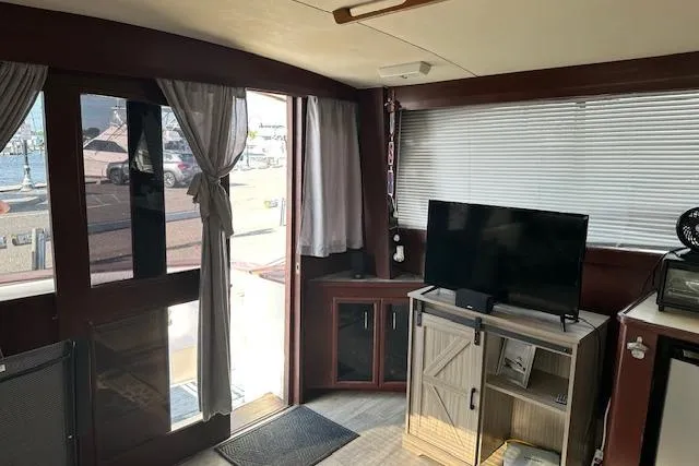 Slide: The Image of Interior of 1986 Egg Harbor 37 Convertible yacht with TV and cabinets. - 28