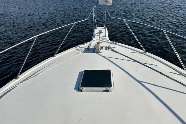 Slide: The Image of 1986 Egg Harbor 37 Convertible boat deck on calm water. - 30