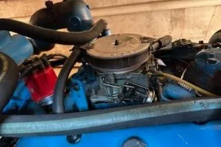 Slide: The Image of Engine of a 1986 Egg Harbor 37 Convertible boat, showcasing mechanical components. - 37