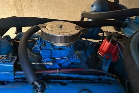 Slide: The Image of 1986 Egg Harbor 37 Convertible engine with blue components and red distributor cap. - 42