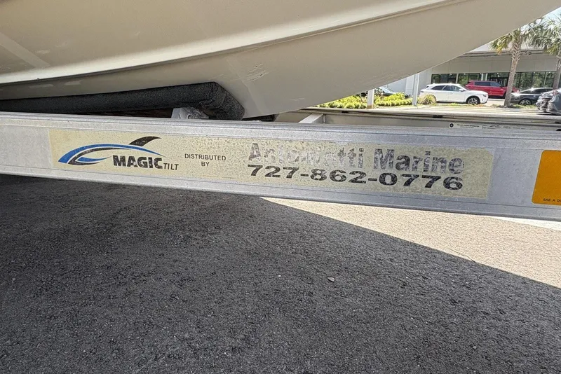 Slide: The Image of Trailer for 2016 Bayliner 215 Deck Boat by Magic Tilt, distributed by Anclote Marine. - 29