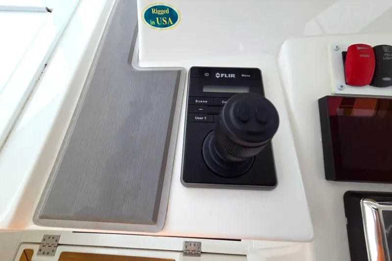 Slide: The Image of Helm of 2022 Albemarle 36 Express with advanced navigation displays and controls. - 13