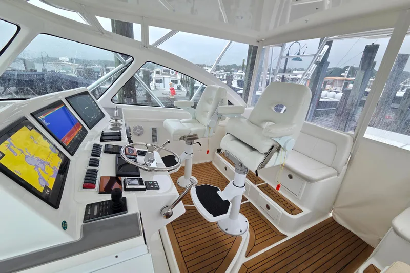 Slide: The Image of Control panel of 2022 Albemarle 36 Express boat with FLIR system and USA rigging sticker. - 15