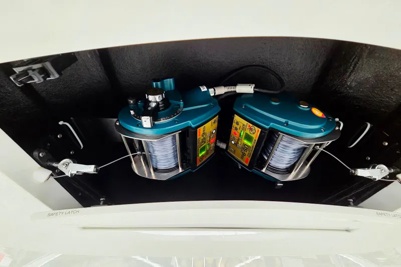 Slide: The Image of 2022 Albemarle 36 Express boat interior detail with white seating and wood flooring. - 21