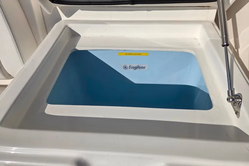 Slide: The Image of 2022 Albemarle 36 Express boat cockpit with seating and wooden table. - 27