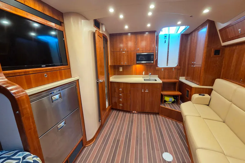 Slide: The Image of Albemarle 36 Express 2022 boat cooler compartment with Frigibar branding. - 29