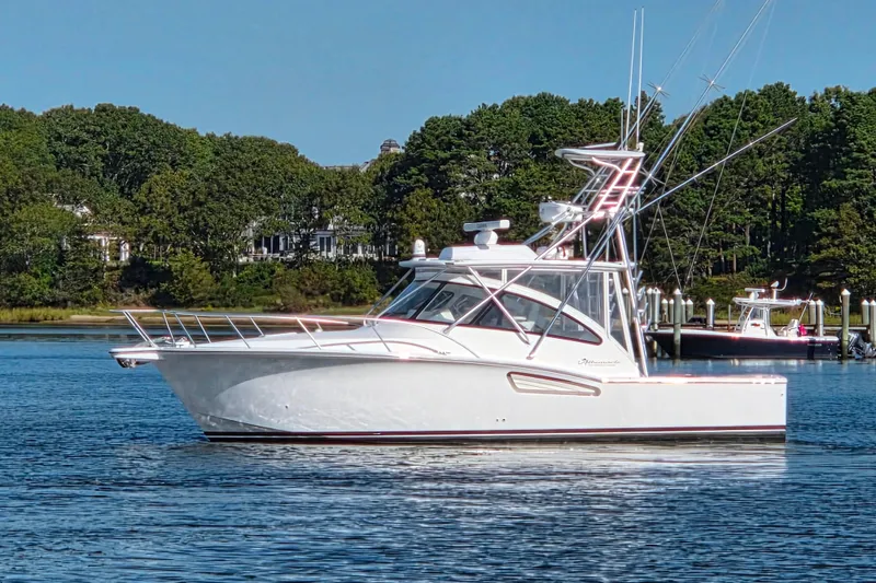 Slide: The Image of 2022 Albemarle 36 Express boat on calm water under clear blue sky. - 3