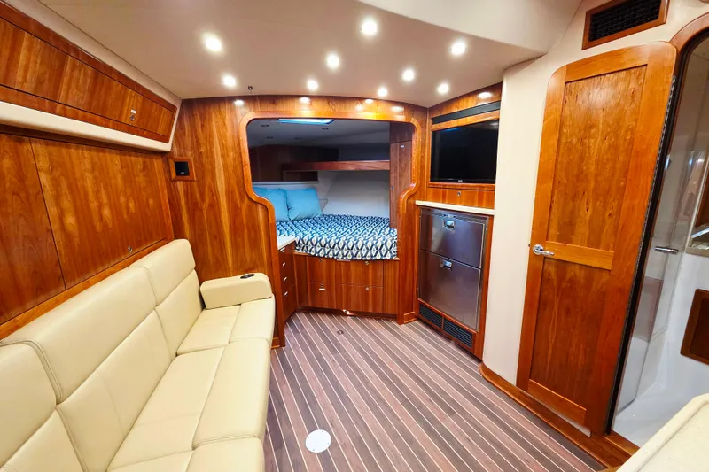 Slide: The Image of Livewell compartment on 2022 Albemarle 36 Express boat, featuring a secure latch and clear lid. - 30