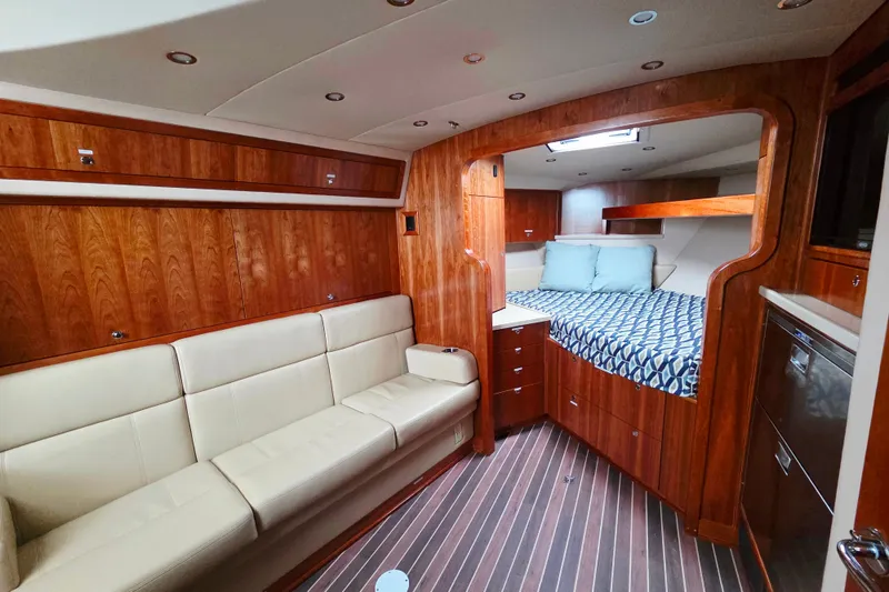 Slide: The Image of Luxurious interior of 2022 Albemarle 36 Express yacht with modern amenities and wood finishes. - 31