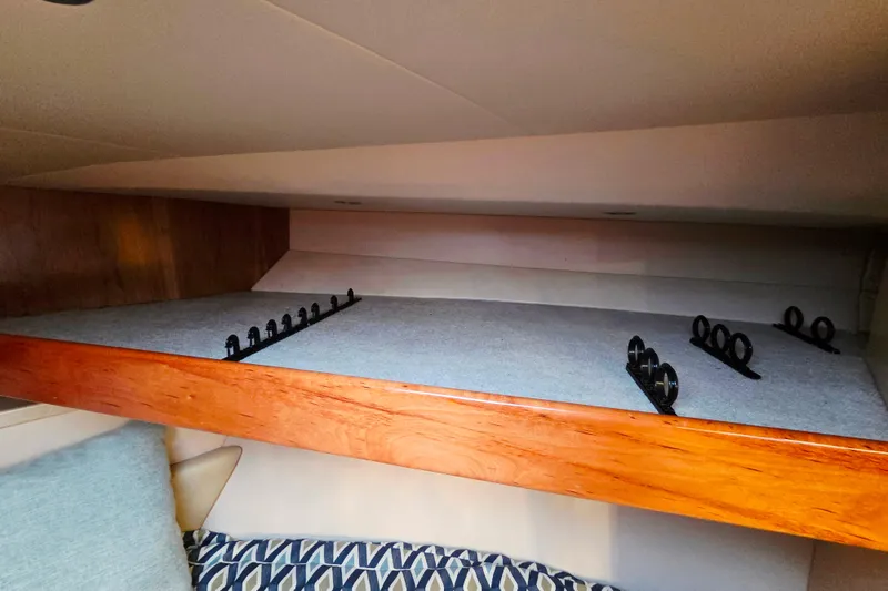 Slide: The Image of Luxurious interior of 2022 Albemarle 36 Express yacht with wood finish and cozy seating. - 33