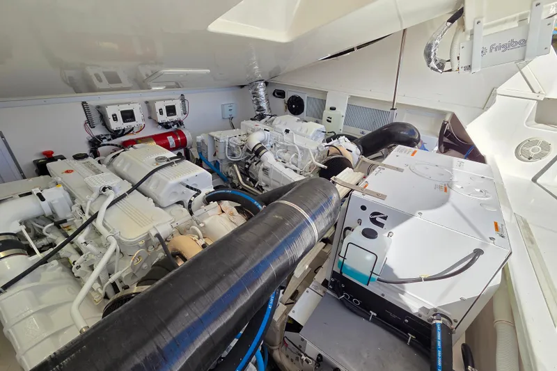 Slide: The Image of Engine room of 2022 Albemarle 36 Express boat, featuring modern equipment and controls. - 40