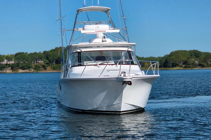 Slide: The Image of 2022 Albemarle 36 Express boat on calm water with clear blue sky. - 6