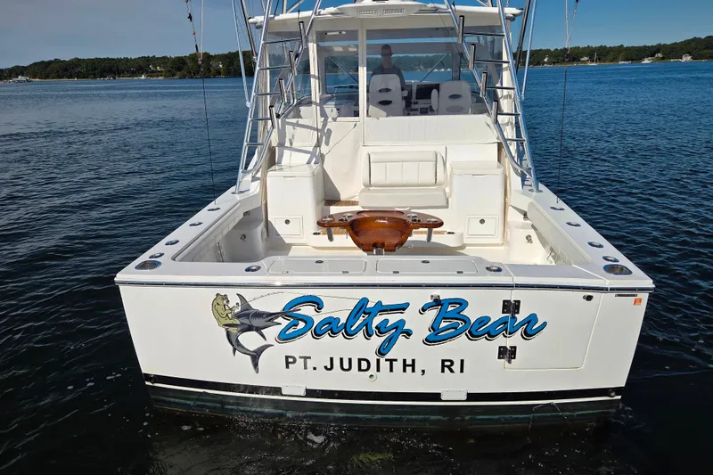 Slide: The Image of 2022 Albemarle 36 Express boat on calm water with clear blue sky. - 7