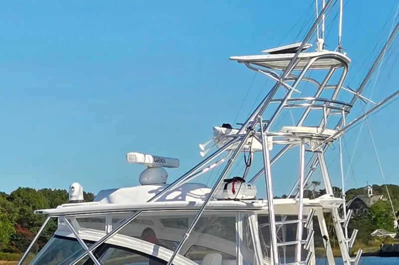 Slide: The Image of 2022 Albemarle 36 Express boat on calm water, clear sky background. - 8