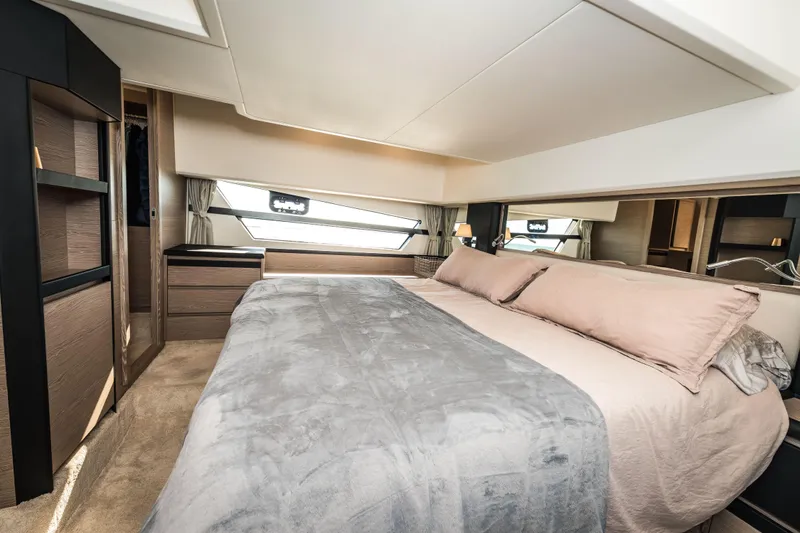 Slide: The Image of Luxurious bedroom interior of 2024 Greenline 45 Coupe Hybrid yacht, featuring elegant design. - 15