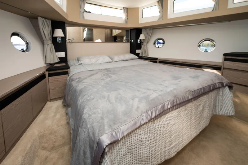 Slide: The Image of Luxurious bedroom interior of 2024 Greenline 45 Coupe Hybrid yacht, featuring elegant design. - 17