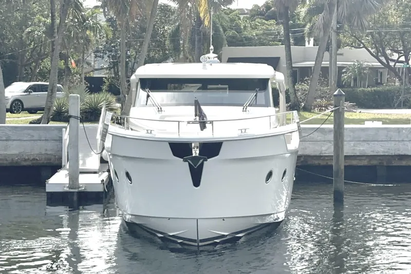 Slide: The Image of 2024 Greenline 45 Coupe Hybrid yacht docked at a marina, front view. - 31
