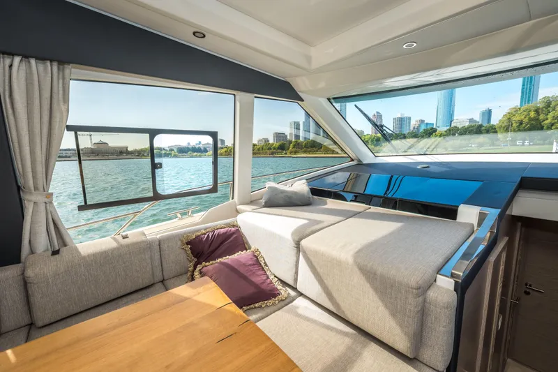 Slide: The Image of Interior of 2024 Greenline 45 Coupe Hybrid yacht with waterfront city view. - 8