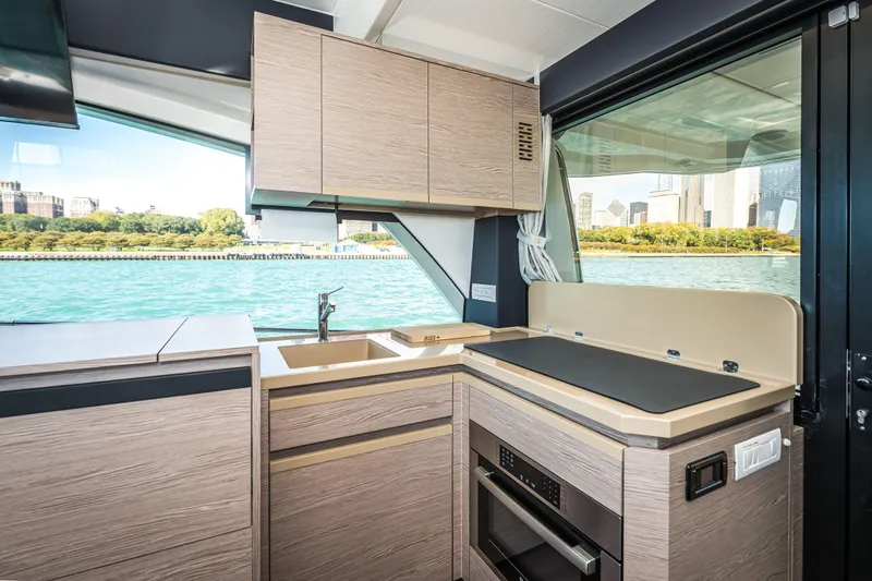 Slide: The Image of Interior of 2024 Greenline 45 Coupe Hybrid yacht with modern kitchen design. - 9