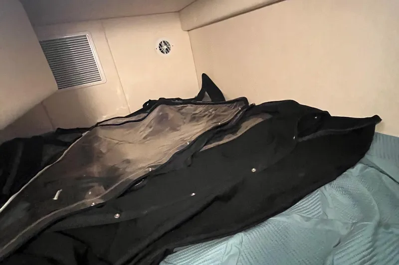 Slide: The Image of Interior cabin of 2006 Sea Ray 260 Sundancer with bedding and storage. - 14