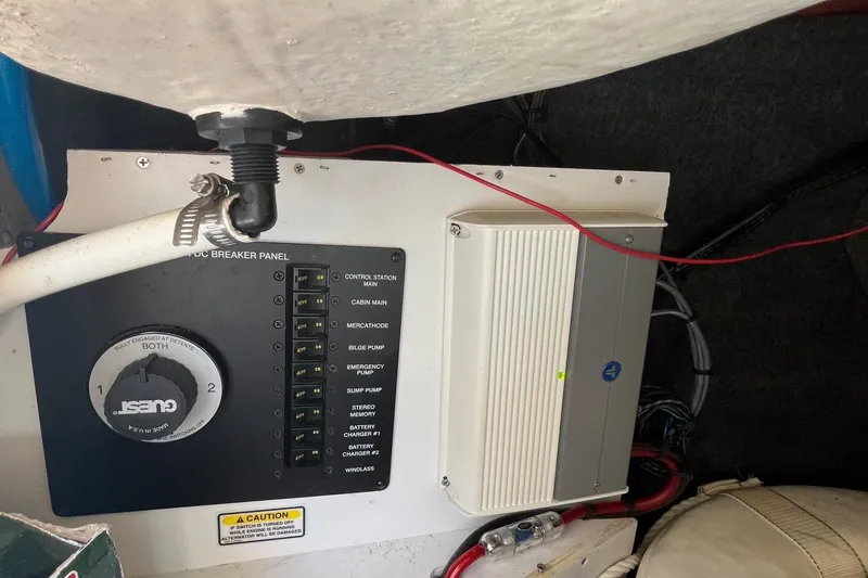 Slide: The Image of Electrical panel and components inside a 2006 Sea Ray 260 Sundancer boat. - 17
