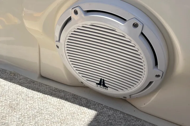 Slide: The Image of JL Audio speaker on 2006 Sea Ray 260 Sundancer boat, mounted on beige surface. - 7