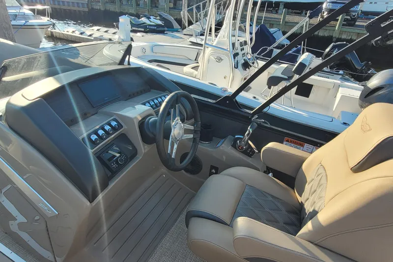 Slide: The Image of 2024 Bennington 24LXSSB boat interior with steering wheel and control panel. - 19