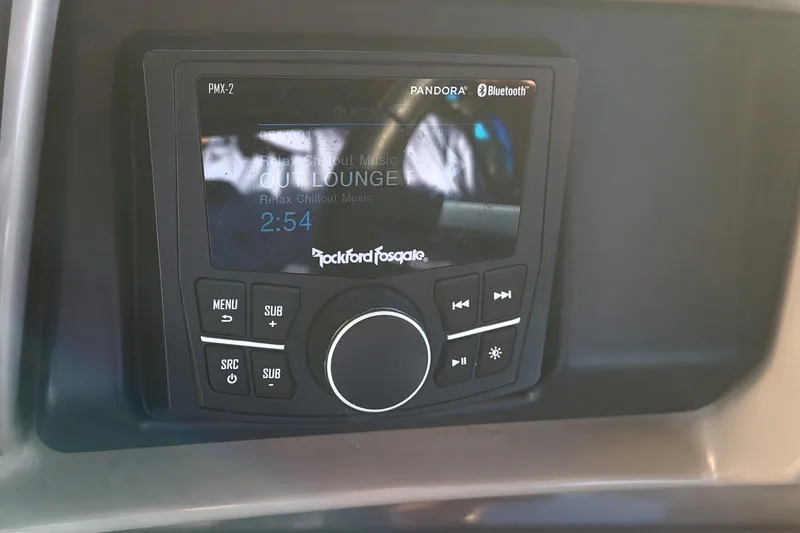 Slide: The Image of Rockford Fosgate audio system in 2024 Bennington 24LXSSB, displaying music interface. - 37