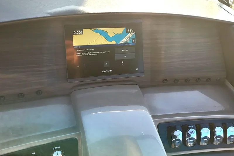 Slide: The Image of Dashboard of 2024 Bennington 24LXSSB with Garmin navigation display and control panel. - 38