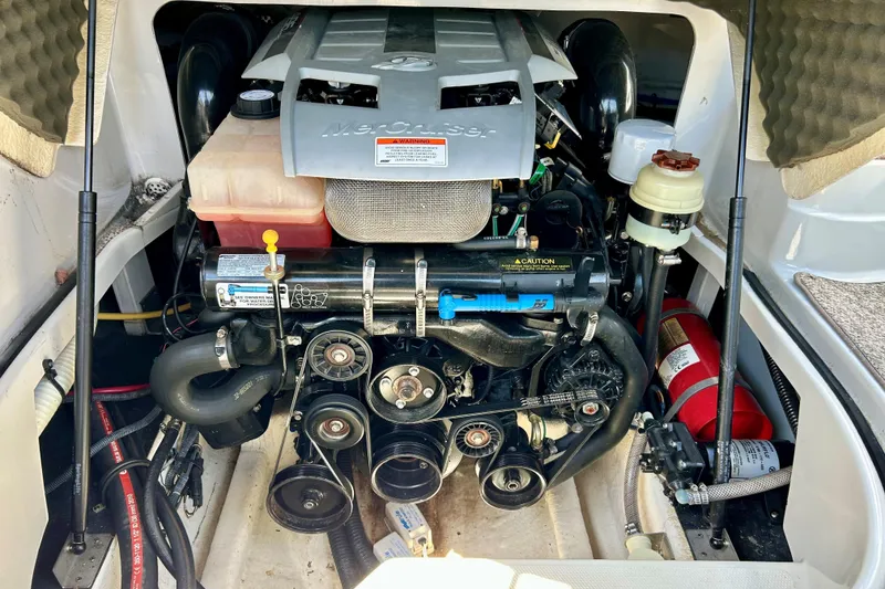 Slide: The Image of Engine compartment of a 2011 Crownline 286 SC boat, showcasing mechanical components. - 13