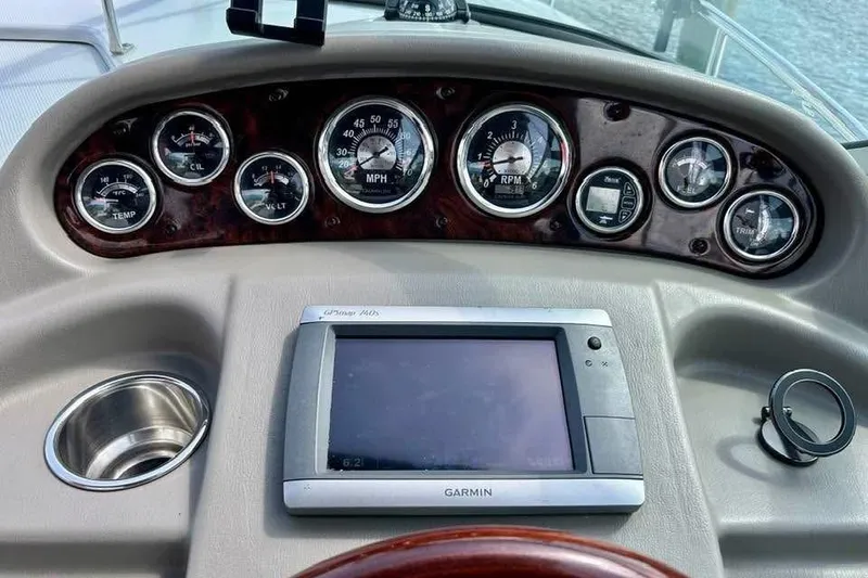 Slide: The Image of Dashboard of 2011 Crownline 286 SC boat with gauges and Garmin GPS. - 2