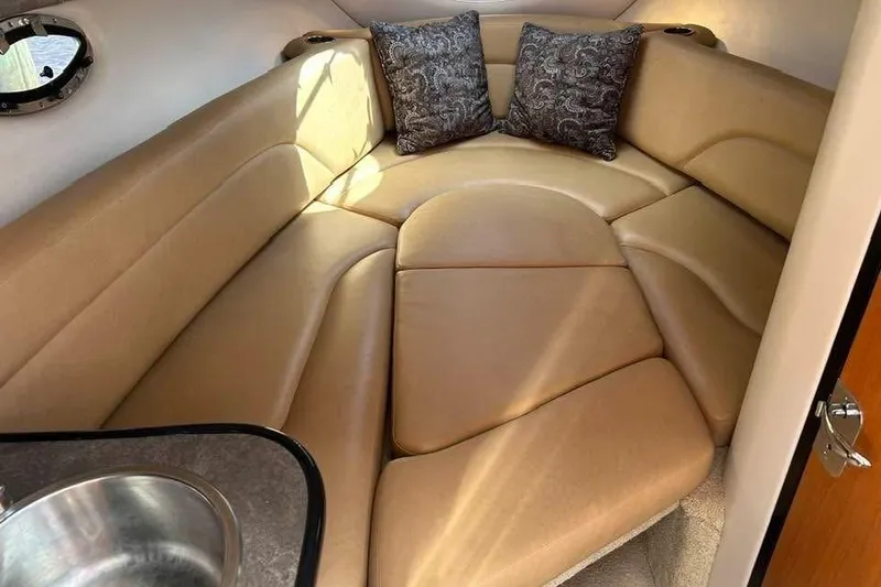 Slide: The Image of Luxurious interior of 2011 Crownline 286 SC boat with plush seating and pillows. - 6