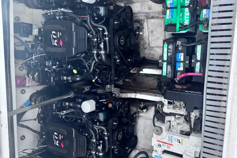 Slide: The Image of Engine compartment of a 2005 Sea Ray 300 Sundancer with dual engines and batteries. - 18