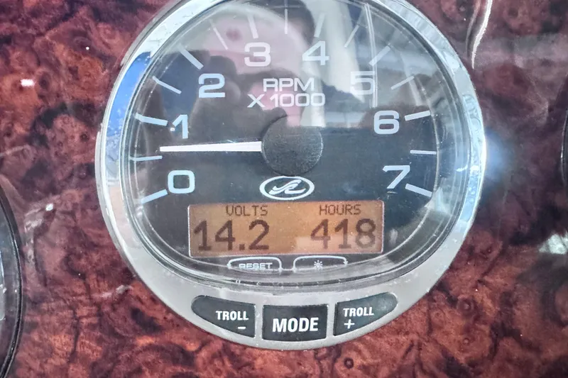 Slide: The Image of Close-up of 2005 Sea Ray 300 Sundancer tachometer showing 14.2 volts and 418 hours. - 23