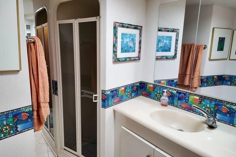 Slide: The Image of Luxurious interior of 1999 Viking Cockpit Sports Yacht with cozy bedroom and elegant decor. - 12