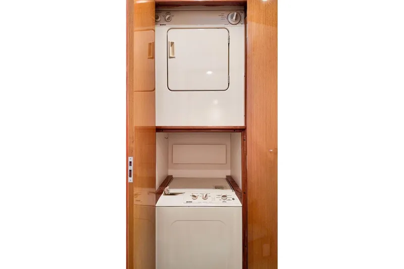 Slide: The Image of Bunk beds in 1999 Viking Cockpit Sports Yacht cabin with red and yellow bedding. - 17