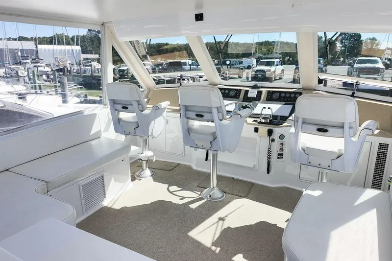 Slide: The Image of Control panel inside 1999 Viking Cockpit Sports Yacht, featuring switches and digital displays. - 20