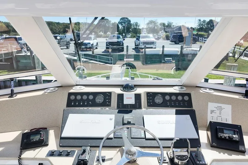 Slide: The Image of Laundry area in 1999 Viking Cockpit Sports Yacht with stacked washer and dryer. - 21