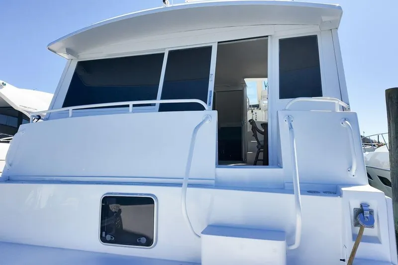 Slide: The Image of Cockpit view of a 1999 Viking Cockpit Sports Yacht with navigation instruments. - 24